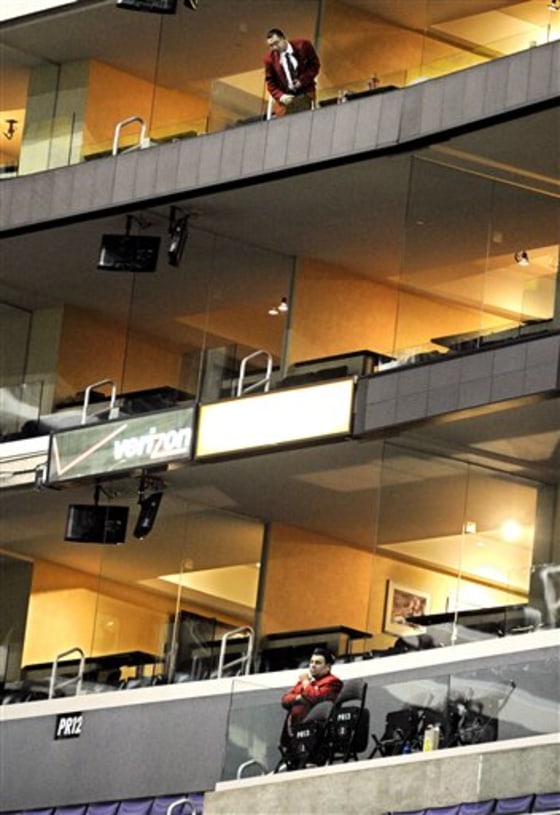 A security guard, top, looks down from where a young boy fell at Staples Center.